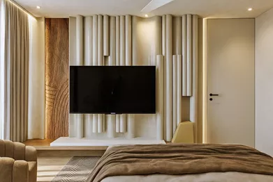 Luxury bedroom at Vaas Aspire with contemporary decor and wooden panel wall